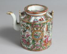A CHINESE CANTON PORCELAIN TEAPOT AND COVER painted with panels of figures, birds, and native flora.