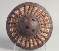 A 17TH CENTURY TURKISH OTTOMAN KALKAN BUCKLER SHIELD, 26cm diameter.