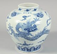 A CHINESE BLUE AND WHITE PORCELAIN JAR painted with a dragon and lion masks, the shoulder with