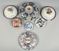 A COLLECTION OF SEVEN CHINESE AND JAPANESE PORCELAIN COVERS, various sizes, (7).