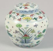 A SMALL CHINESE DOUCAI PORCELAIN GINGER JAR AND COVER painted with ducks and aquatic flora. 9cm