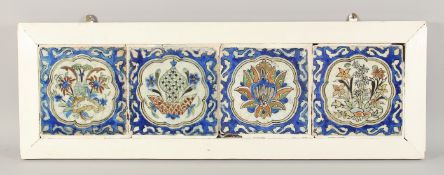 FOUR 17TH CENTURY KUBACHI GLAZED POTTERY TILES, each tile in square form and painted in cobalt blue,