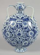 A CHINESE BLUE AND WHITE PORCELAIN TWIN-HANDLED MOON FLASK decorated with multiple panels of