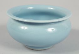 A SMALL CHINESE POWDER BLUE GLAZE BOWL, with mark to base, 10cm diameter.