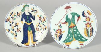 TWO TURKISH KUTAHYA GLAZED POTTERY DISHES, painted with a male and female figure central and
