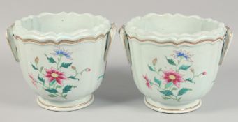A LARGE PAIR OF 18TH CENTURY CHINESE FAMILLE ROSE TWIN-HANDLED JARDINIERES, each painted with sprays