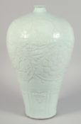 A VERY LARGE CELADON GLAZE PORCELAIN MEIPING VASE, the body with carved decoration depicting large