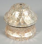 A TURKISH OTTOMAN MOTHER OF PEARL CIRCULAR BOX AND COVER, 9cm diameter.