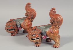 A PAIR OF JAPANESE KUTANI PORCELAIN TEMPLE DOGS (lacking covers), 20cm long