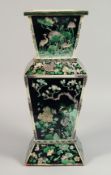 A LARGE 19TH CENTURY CHINESE FAMILLE VERTE SQUARE FORM PORCELAIN VASE, painted with panels of native
