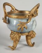 A LARGE CHINESE POWDER BLUE CRACKLE GLAZE CENSER WITH GILT METAL MOUNTS, the rim with two metal