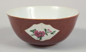 A SMALL CHINESE BROWN GLAZE PORCELAIN BOWL, the exterior with three panels of flowers, 12cm