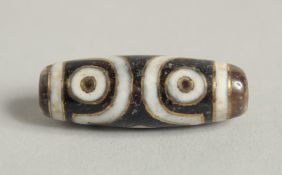 A GOOD INLAID DZI BEAD.