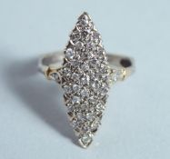 A DIAMOND SET GOLD MARQUISE RING.