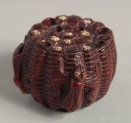 A CARVED WOOD NETSUKE with bugs 2ins.