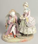 A LARGE DRESDEN PORCELAIN GROUP of an elderly man in a chair, a young girl and dog by his side.