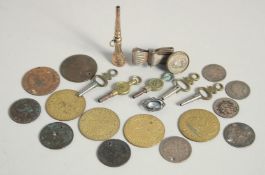 VARIOUS WATCH KEYS AND COINS.