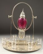 A SILVER PLATED CRANBERRY DECANTER SET with six glasses.