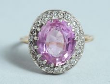 A SAPPHIRE AND DIAMOND CLUSTER RING.