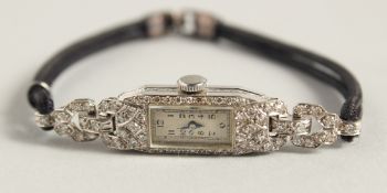 A LADIES’ DIAMOND SET COCKTAIL WATCH with rope bracelet. No. 2160.