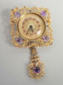 A LADIES 18CT GOLD RONDINE RUBY AND DIAMOND SET BROOCH DRESS WATCH.