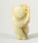 A SMALL CHINESE CARVED JADE FIGURE OF A BOY, possibly Ming Dynasty, 5.5cm high.