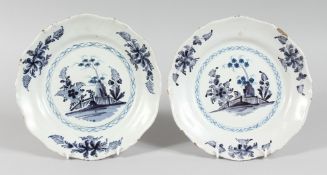 A PAIR OF 19TH CENTURY TIN GLAZE PLATES with Fence pattern etc. 9ins diameter.