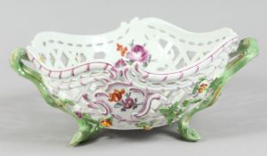 A GOOD MEISSEN PIERCED TWO HANDLED BASKET painted and encrusted with flowers. Cross swords mark in