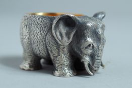 A RUSSIAN SILVER ELEPHANT SALT with silver gilt interior. Mark 84. 4.5cm long.