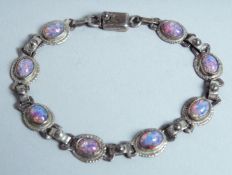 A SILVER AND OPAL BRACELET.