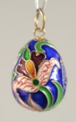 A SILVER AND ENAMEL EGG PENDANT.