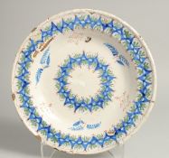 A 19TH CENTURY DELFT TIN GLAZE PLATE. 11.5ins diameter.