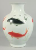 A CHINESE WHITE GROUND PORCELAIN VASE decorated with fish. 18ins high.