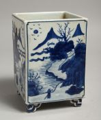 A CHINESE BLUE AND WHITE SQUARE SHAPED BRUSH POT with landscape scenes. 6ins high.