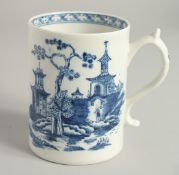 AN 18TH CENTURY LOWESTOFT FINE MUG printed with Chinese landscape and boat, near an island.