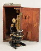 AN E. LEITZ WETZLAR BLACK AND BRASS MICROSCOPE. No. 2186512, in a mahogany case.