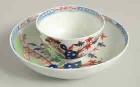 AN 18TH CENTURY LOWESTOFT FINE TEA BOWL AND SAUCER painted with a Redgrave style landscape with