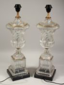 A LARGE PAIR OF GLASS URN SHAPED LAMPS 24ins high.