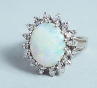 AN 18CT WHITE GOLD, OPAL, AND DIAMOND CLUSTER RING.