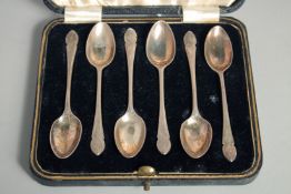 A SET OF SIX SILVER COFFEE SPOONS in a fitted case. Sheffield, 1938.