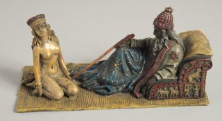 A VIENNA PAINTED BRONZE ARAB AND SLAVE GIRL. 7ins long