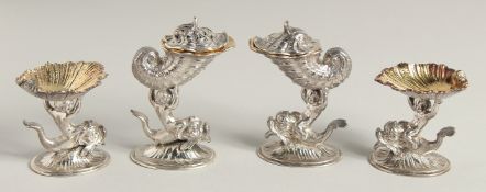 A SET OF FOUR VICTORIAN CONDIMENT POTS by GEORGE FOX formed on water sprites holding shields