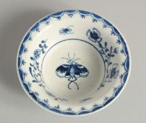 AN 18TH CENTURY LOWESTOFT FINE PATTY PAN painted with a moth and trailing flowering plants.