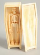 A BONE COFFIN AND SKELETON. 4.5ins long.