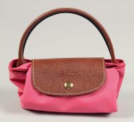 A LONGCHAMP BAG 7ins x 3.5ins with two handles