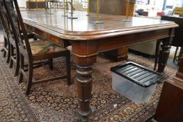 A GOOD 19TH CENTURY MAHOGANY EXTENDING DINING TABLE with two leaves on turned and carved legs with