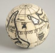 AN ETCHED BONE FOLDING OPEN GLOBE. 2.5ins diameter.