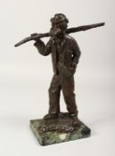CHARLES-EMILLE JONCHERY. A GOOD BRONZE OF AN OLD MAN CARRYING A STICK OVER HIS SHOULDER. Signed.
