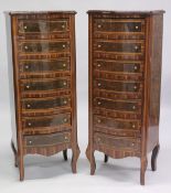 A PAIR OF FRENCH STYLE MAHOGANY AND INLAID SERPENTINE FRONTED, SEVEN DRAWER CHESTS. 4ft high x 1ft