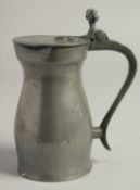 AN 18TH CENTURY PEWTER MEASURE AND COVER. 6.5ins high.